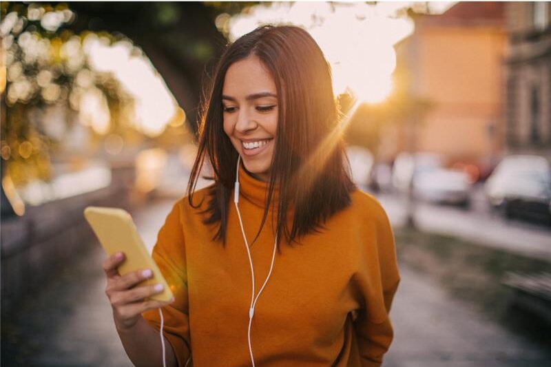 young woman, checking her phone